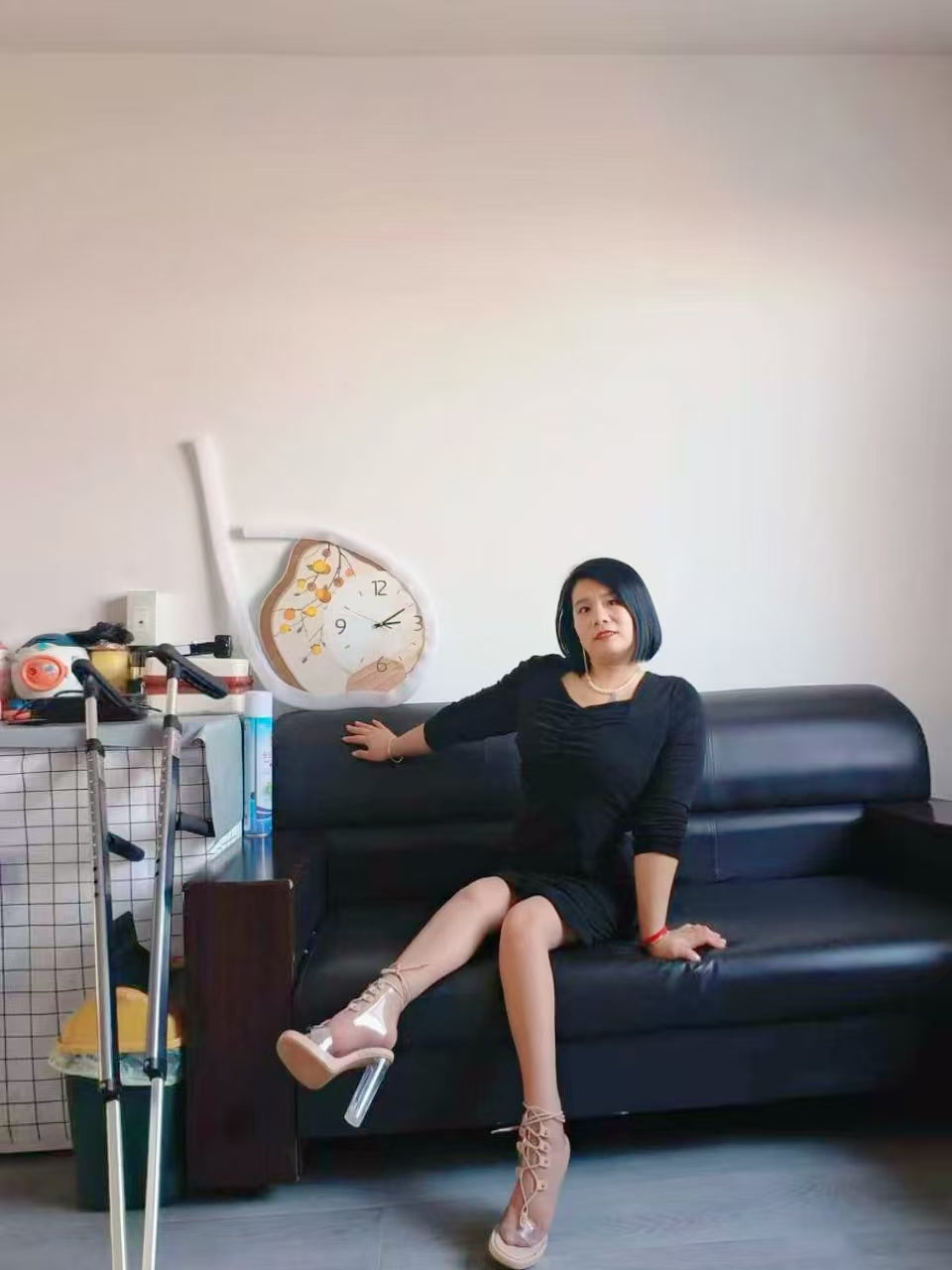 Carrie: A polio Lady patient walks around the house on crutches.