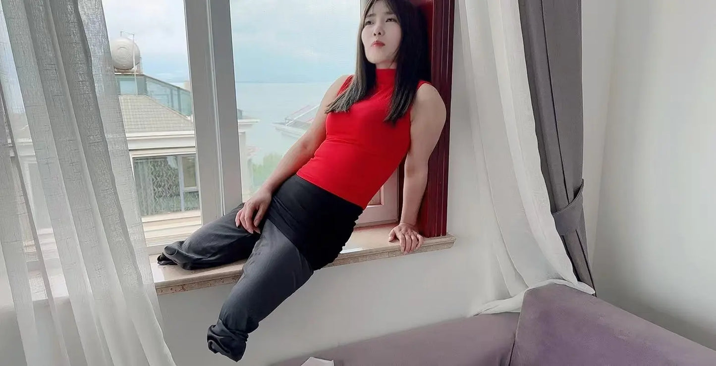 Sally: Dak Amputee Girl - Red clothed girl wearing a pair of prosthetic limbs AmputeeClub