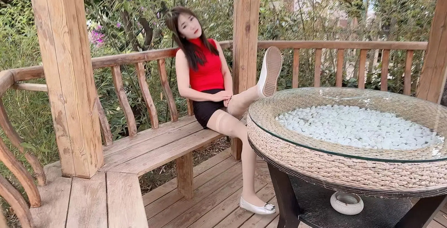 Sally: Dak Amputee Girl - Red clothed girl wearing a pair of prosthetic limbs AmputeeClub
