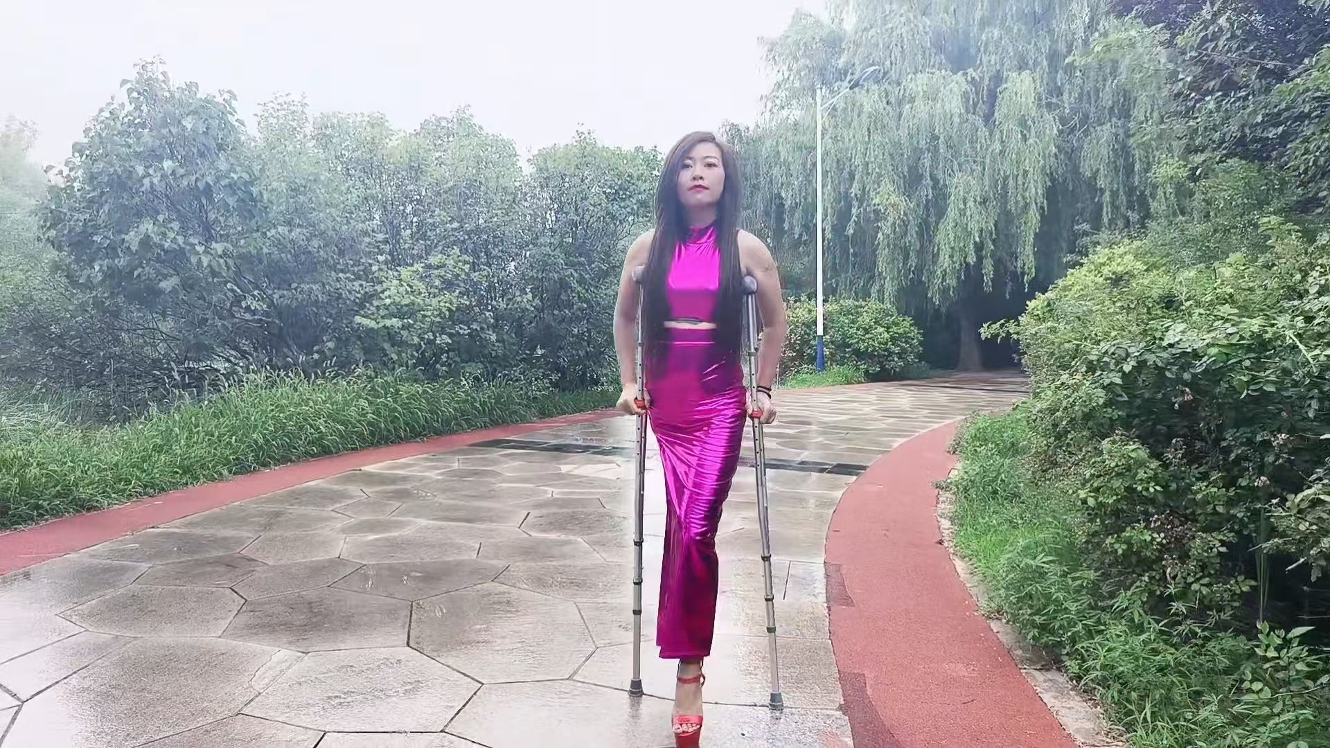 Emma: Shd Amputee Girl - Walking in the park wearing red high heels AmputeeClub