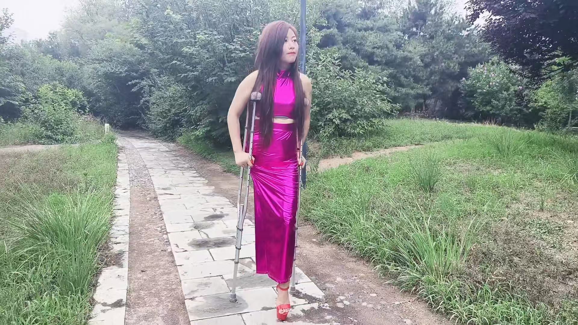 Emma: Shd Amputee Girl - Walking in the park wearing red high heels AmputeeClub