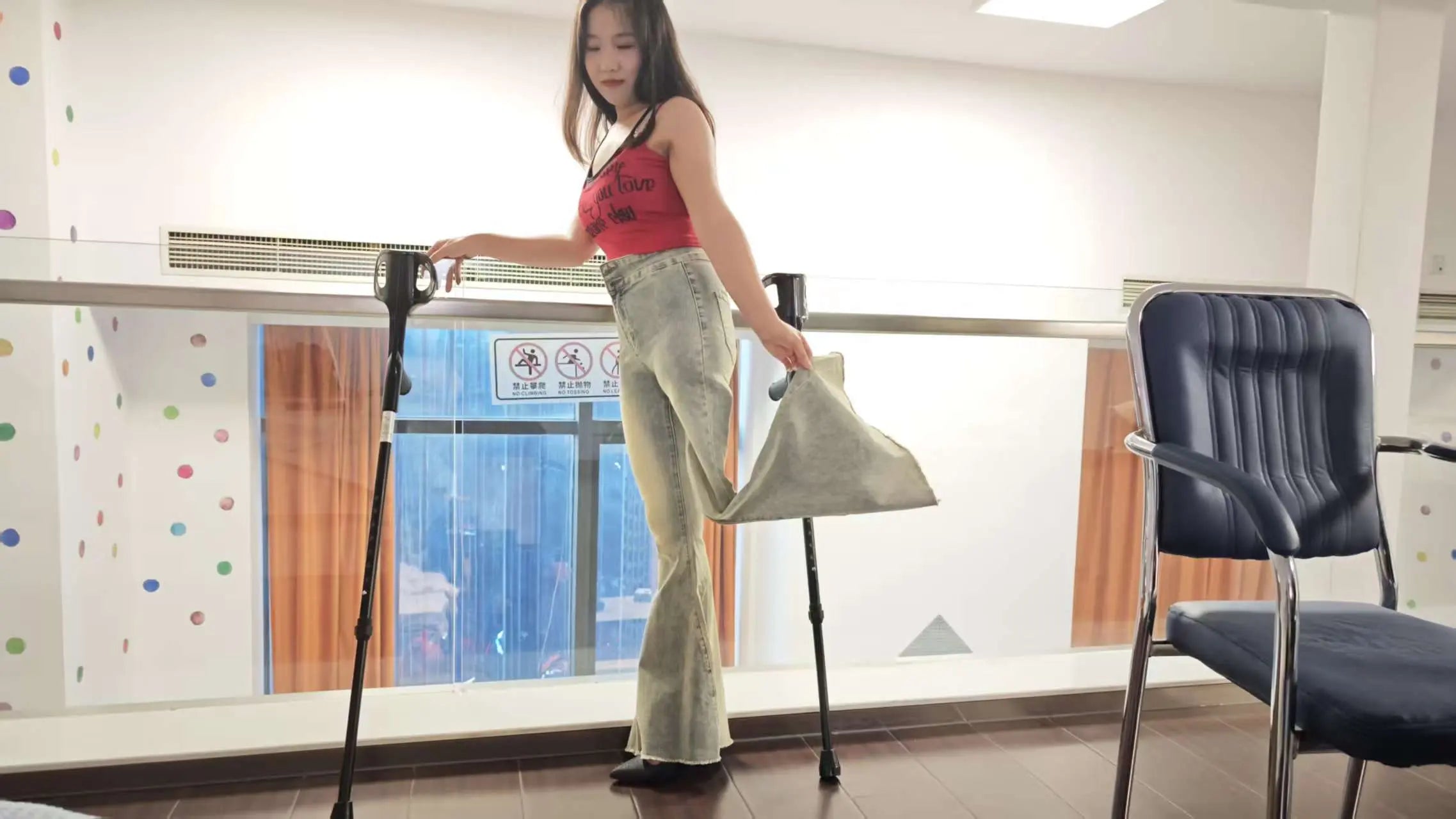 Naomi: Sak, an amputee girl, wearing blue jeans showing her stump