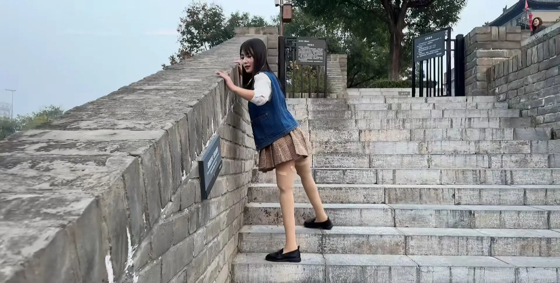 Lanzi, Emma, and Sally, three amputee girls, tour the ancient city walls