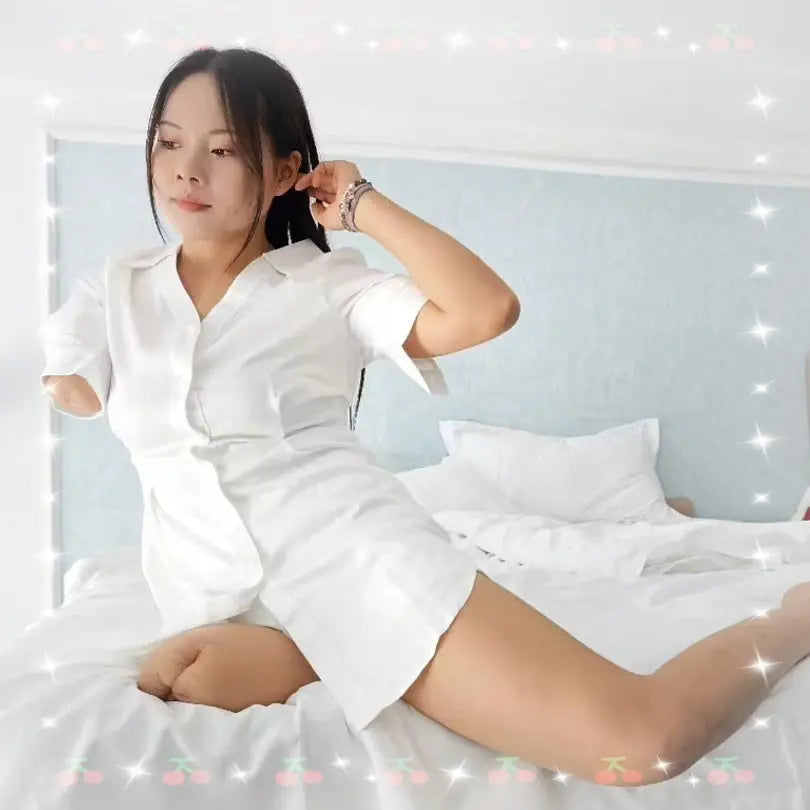 Abby: Ooe Amputee Girl - Wearing a white shirt and white high heels