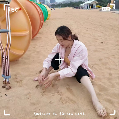 Rose The Polio Girl takes off her shoes and socks and plays on the beach AmputeeClub