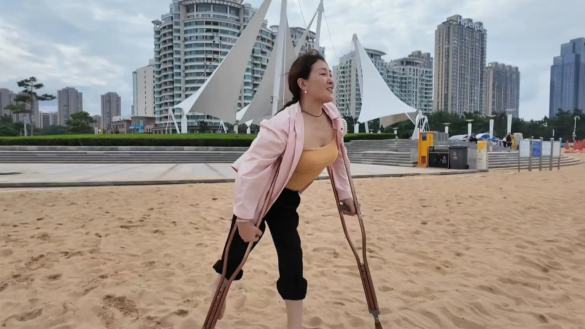 Rose The Polio Girl takes off her shoes and socks and plays on the beach AmputeeClub