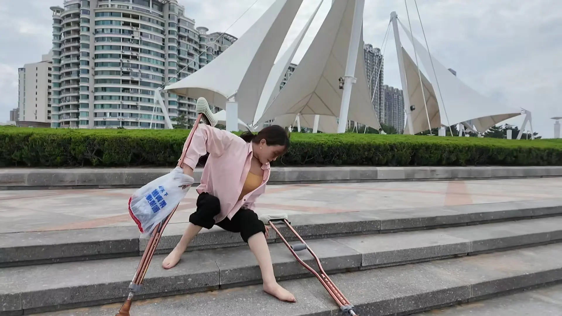 Rose The Polio Girl takes off her shoes and socks and plays on the beach AmputeeClub