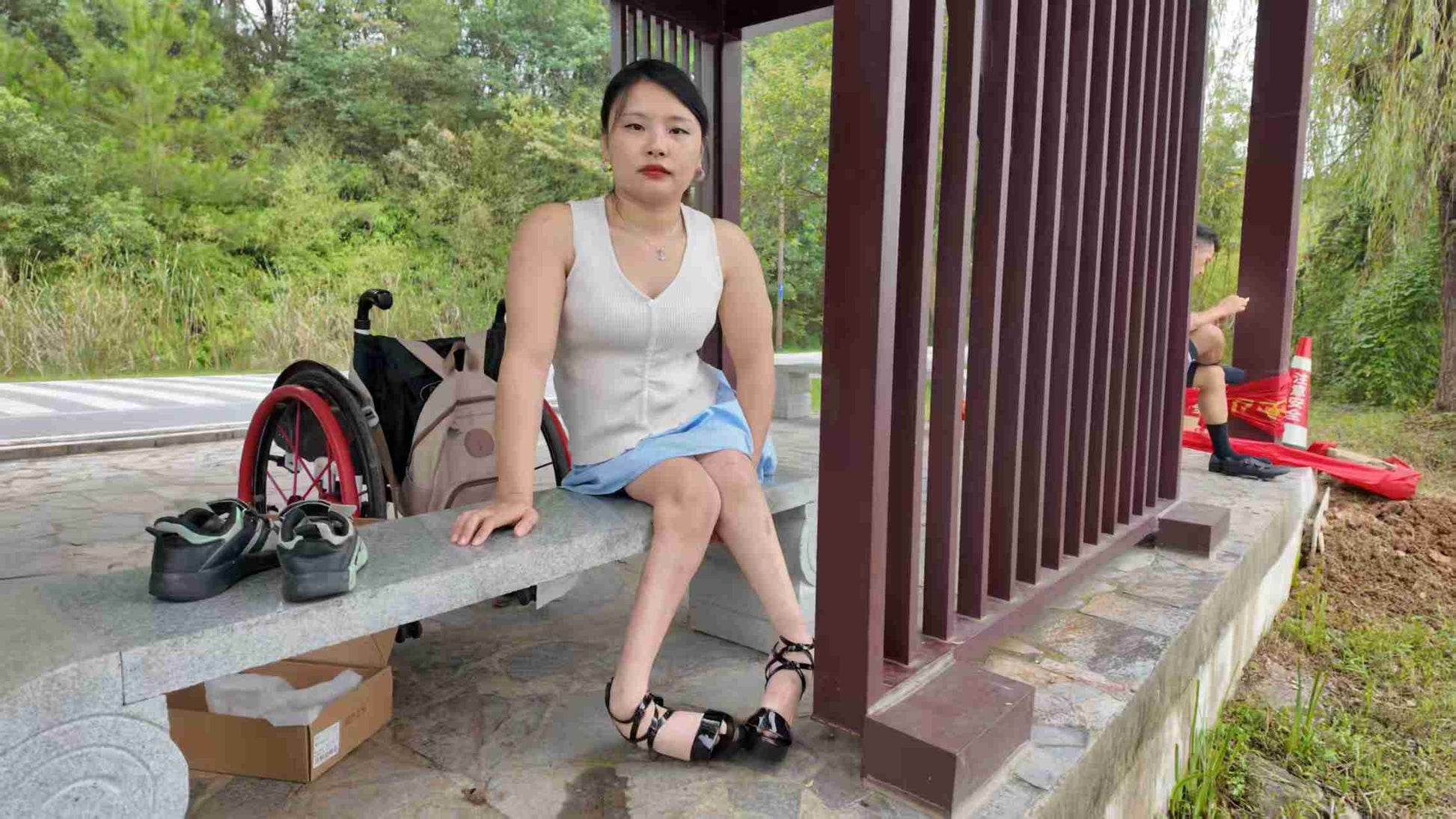 Shera: Paraplegic Girl changing into high heels on a park bench AmputeeClub