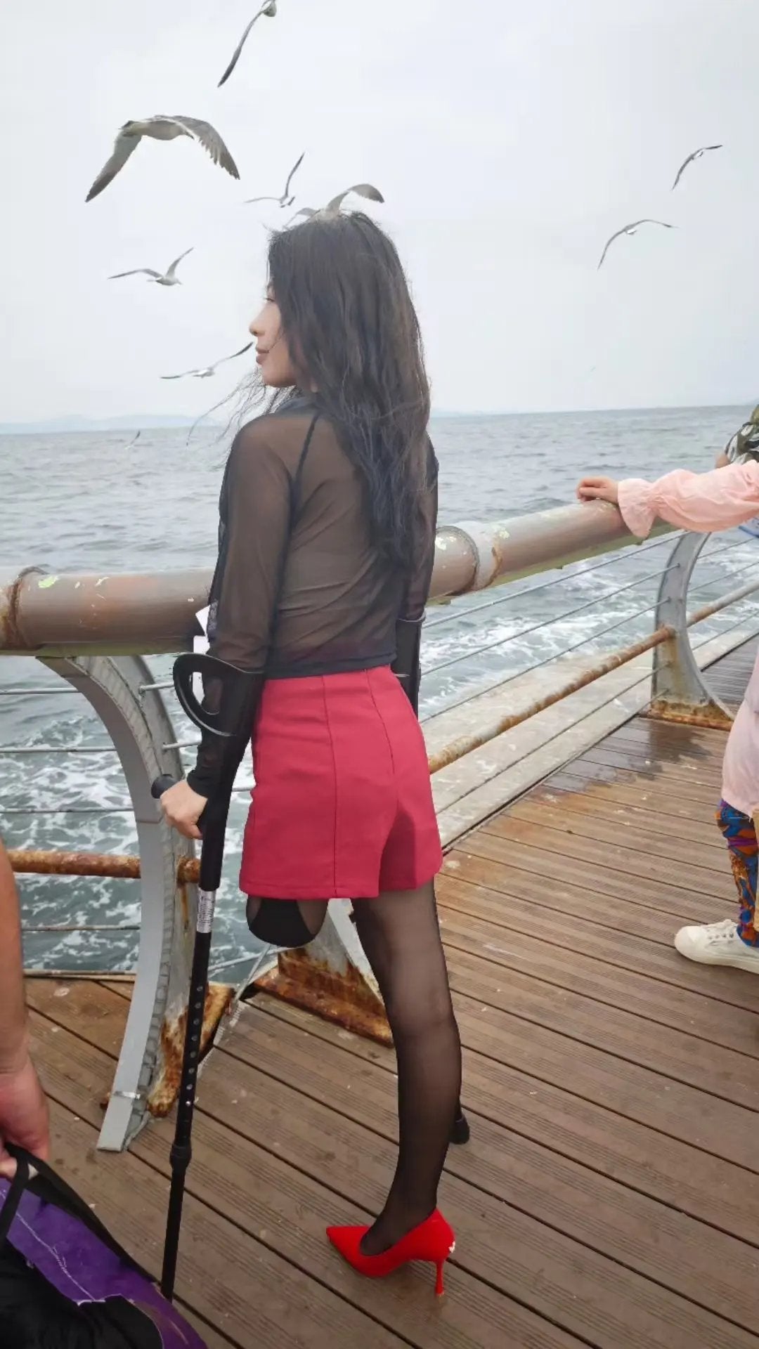 Ayla: Sak Amputee Girl Black stockings and colorful prosthetic limbs for traveling