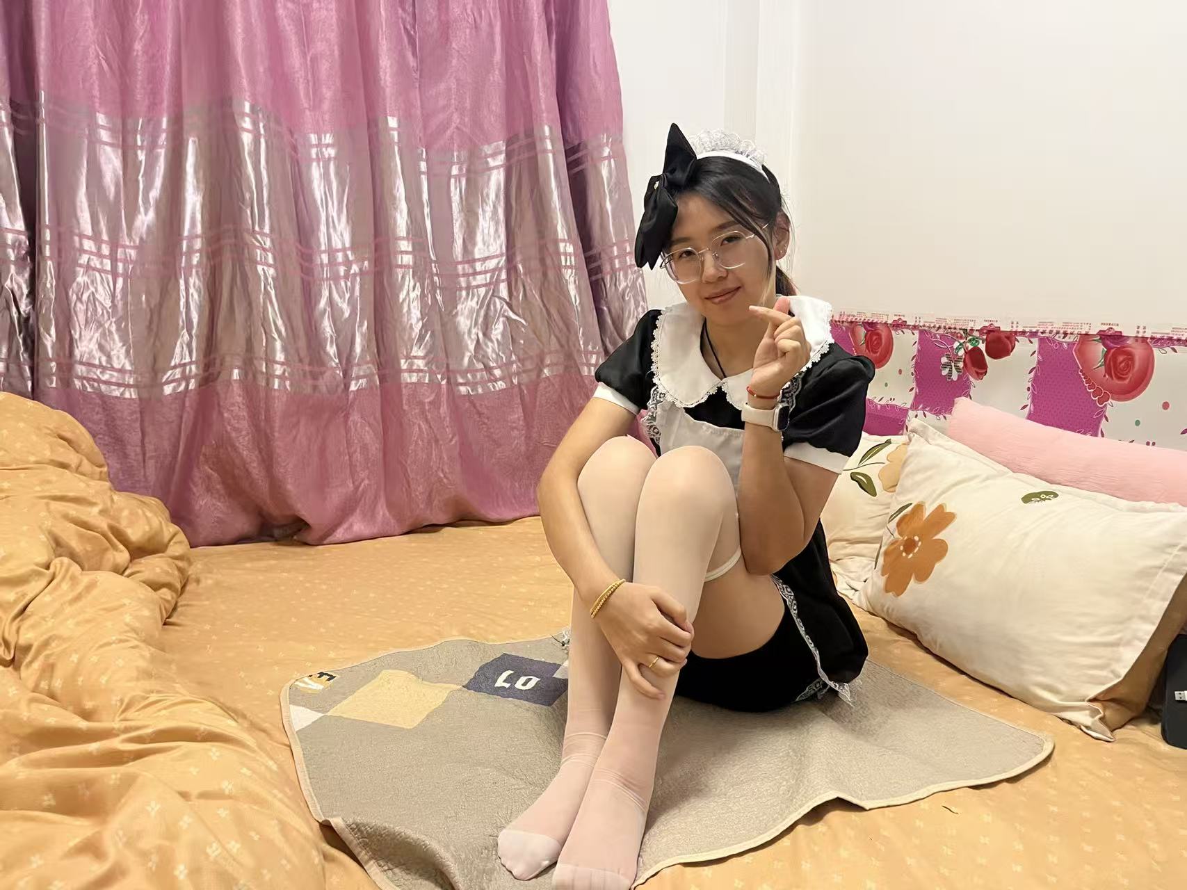 Zoe: Paraplegic Girl, a maid in white stockings, moves on a diaper pad.