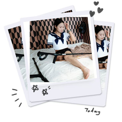 Abby: Ooe Amputee Girl, feeling her prosthetic limb while wearing a Japanese school uniform.