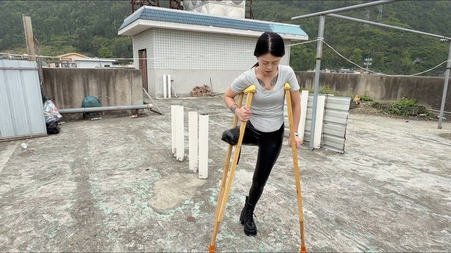 Amy: Sak Amputee Girl - Climbing stairs in leather pants and boots with crutches