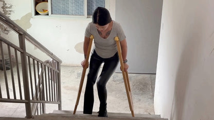 Amy: Sak Amputee Girl - Climbing stairs in leather pants and boots with crutches