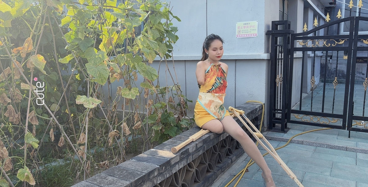 Abby: Ooe, the Amputee Girl - Courtyard Strolls in a Yellow Dress