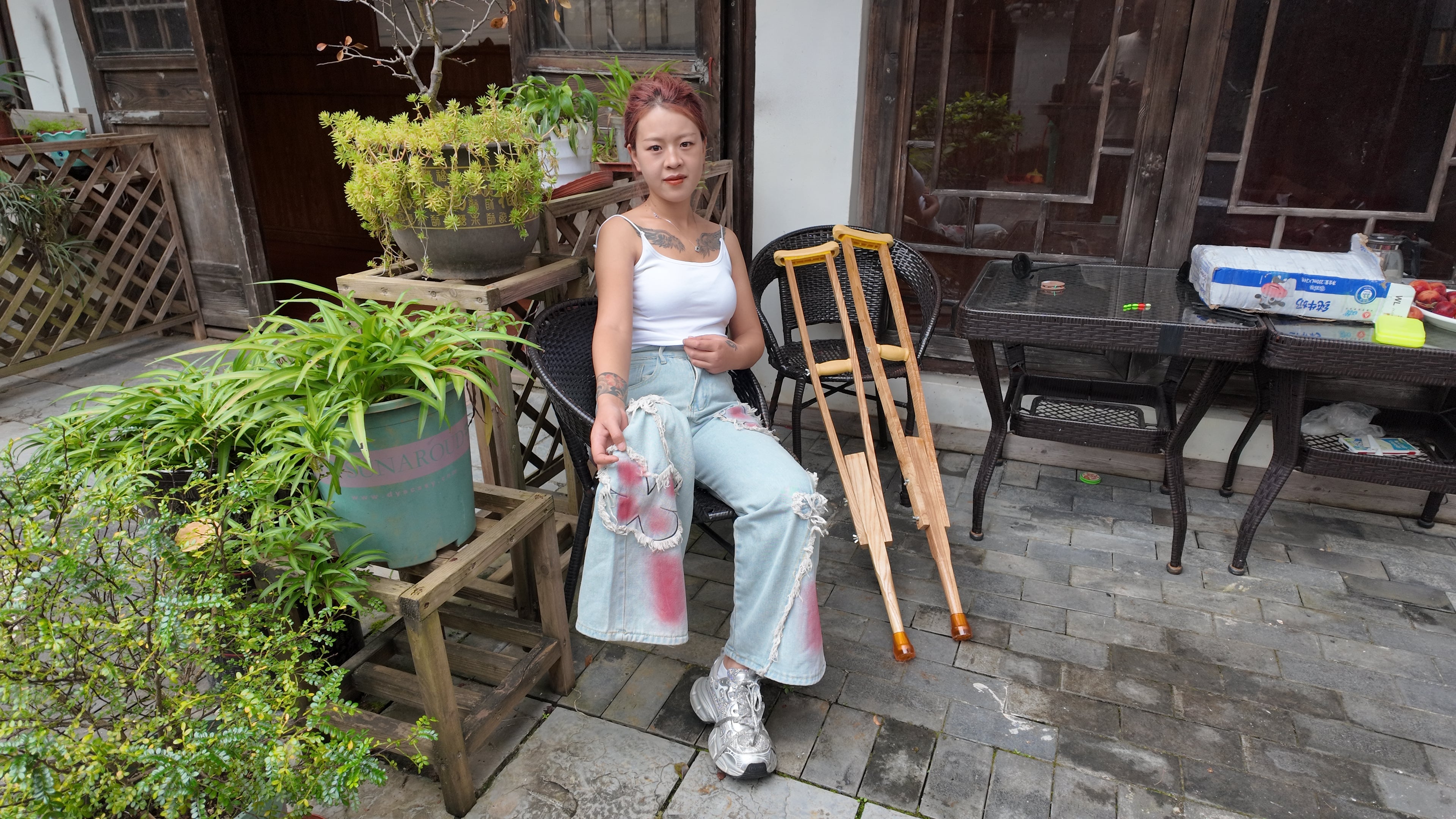 Amy: Sak, the amputee girl, went out to explore for the first time using crutches.