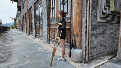Amy: Sak Amputee girl, touring the ancient town on crutches.