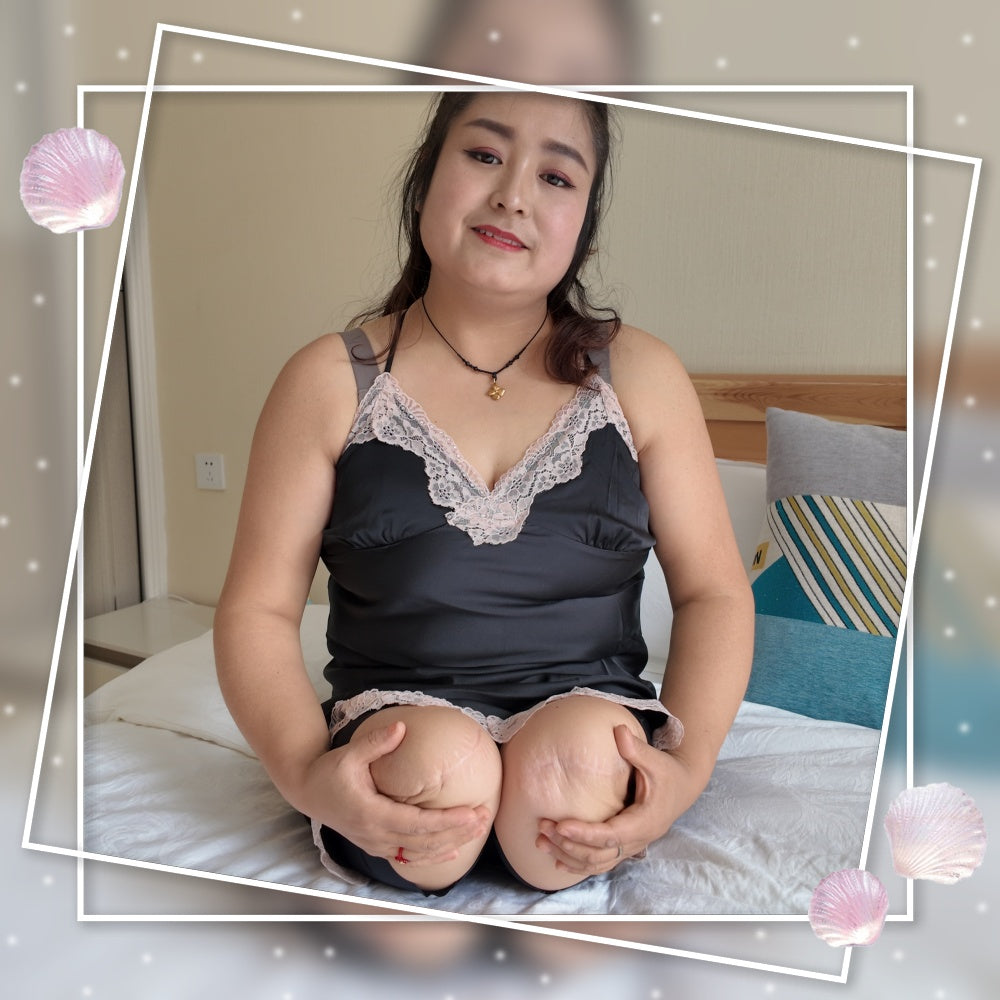 Tina, an amputee girl, wearing stockings with her amputated limbs.