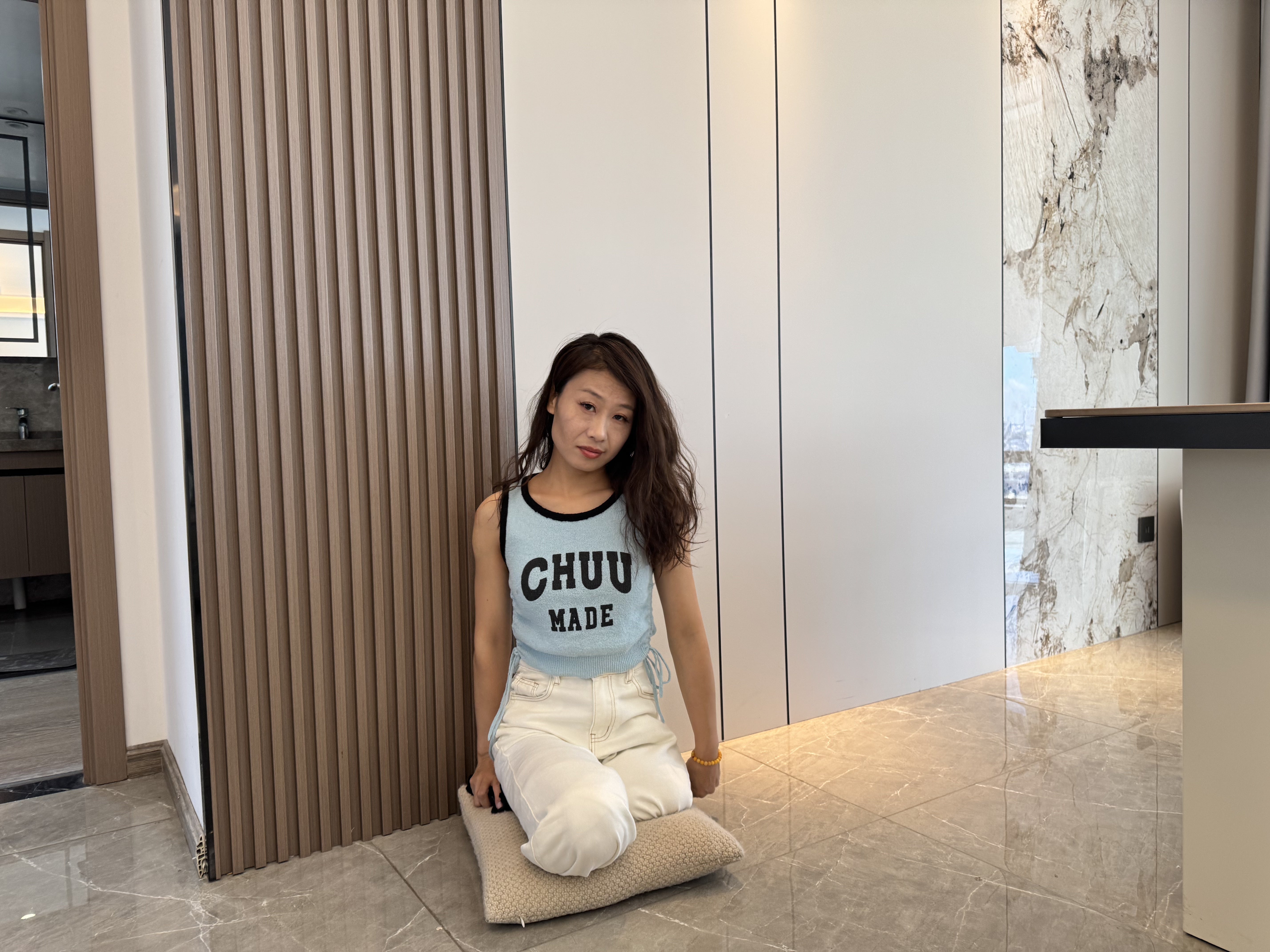 Ayla: Sak Amputee Girl disguised as DBK, gliding on a mat in stockings.