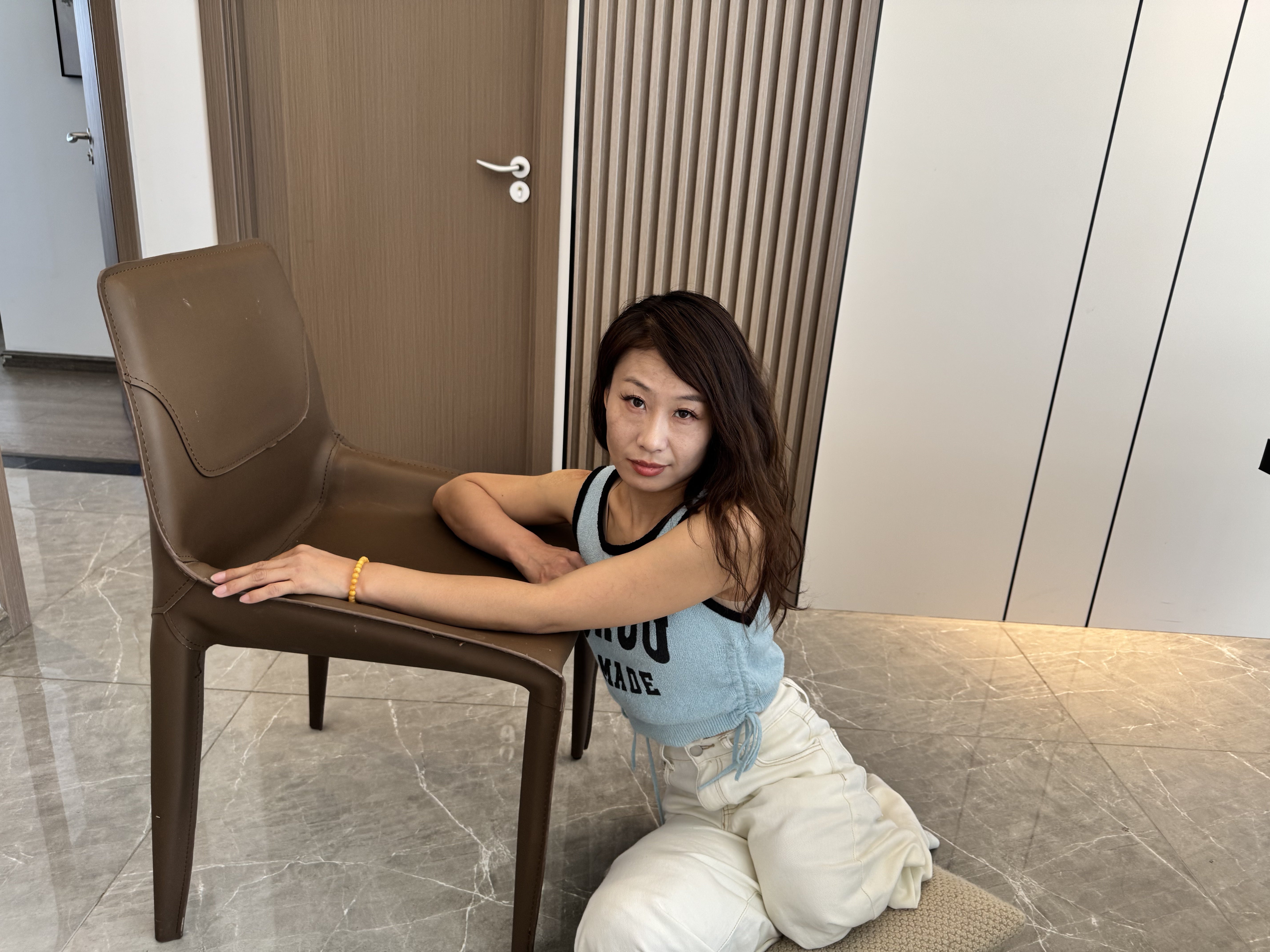 Ayla: Sak Amputee Girl disguised as DBK, gliding on a mat in stockings.