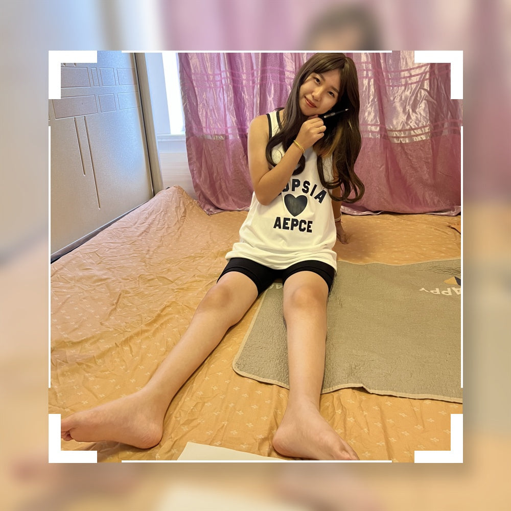 Zoe: The paraplegic girl attempts to write with her numb feet.