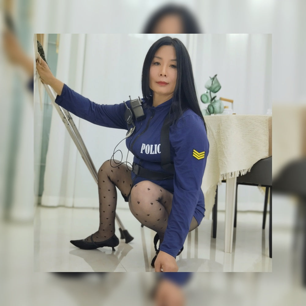 Liona, polio girl, wearing a blue uniform, black polka dot stockings, and high heels