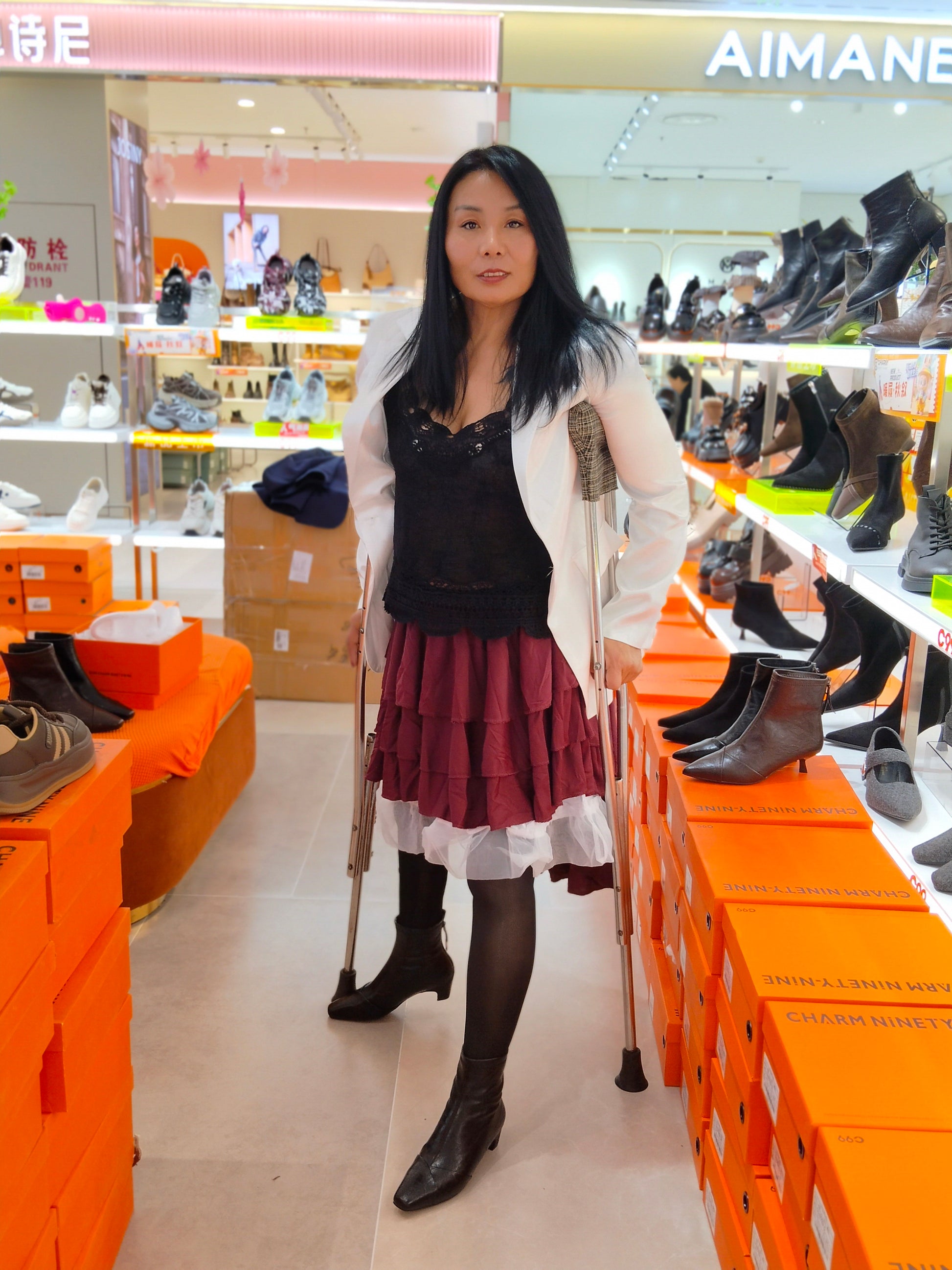 Liona, the polio girl, shopping at the supermarket on crutches