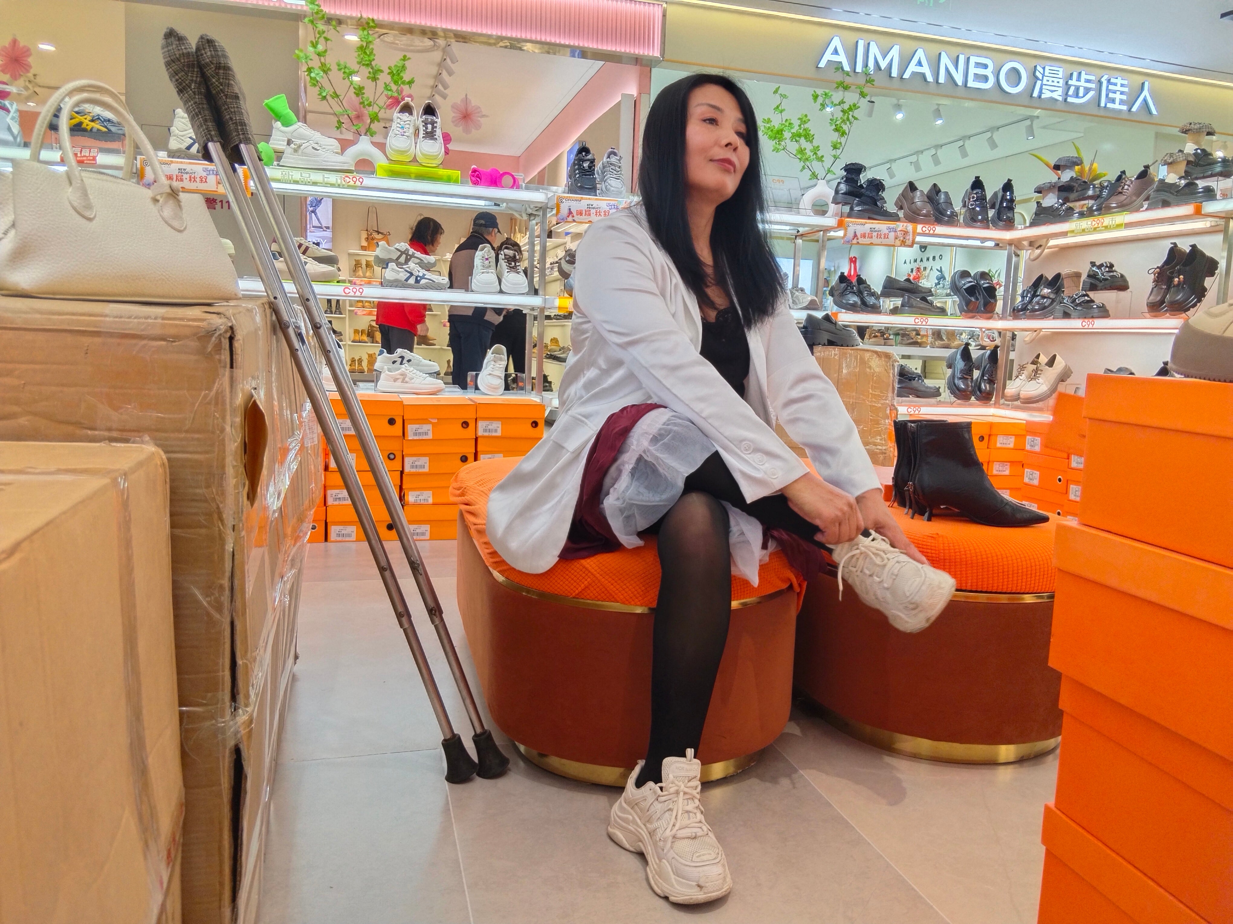 Liona, the polio girl, shopping at the supermarket on crutches