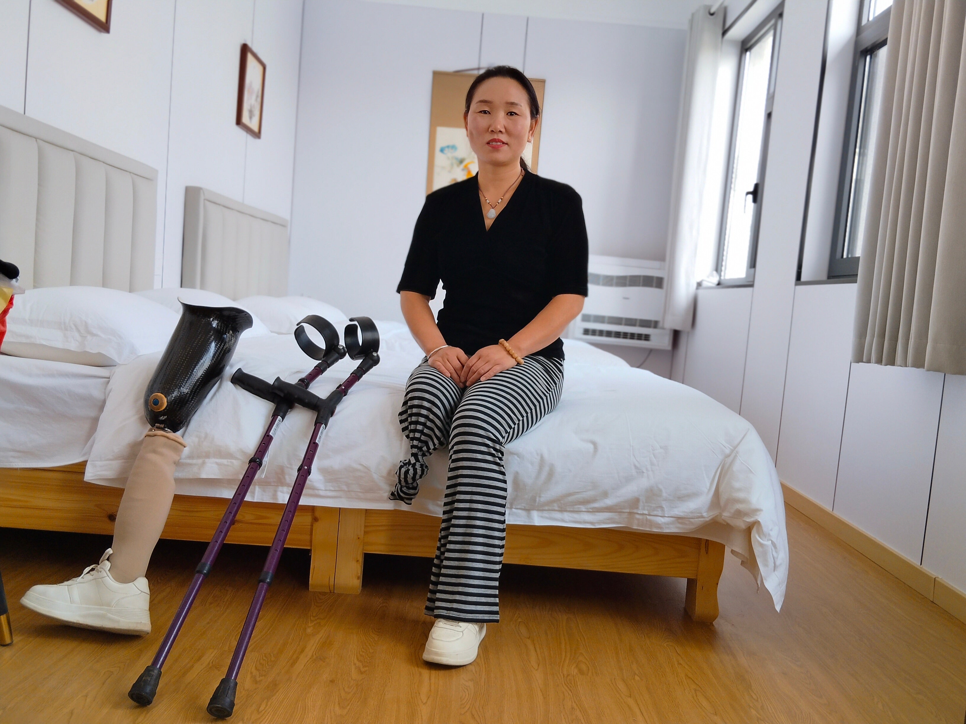 Gigi: Sak Amputee Girl - Using elbow crutches to go out for a walk in spring.