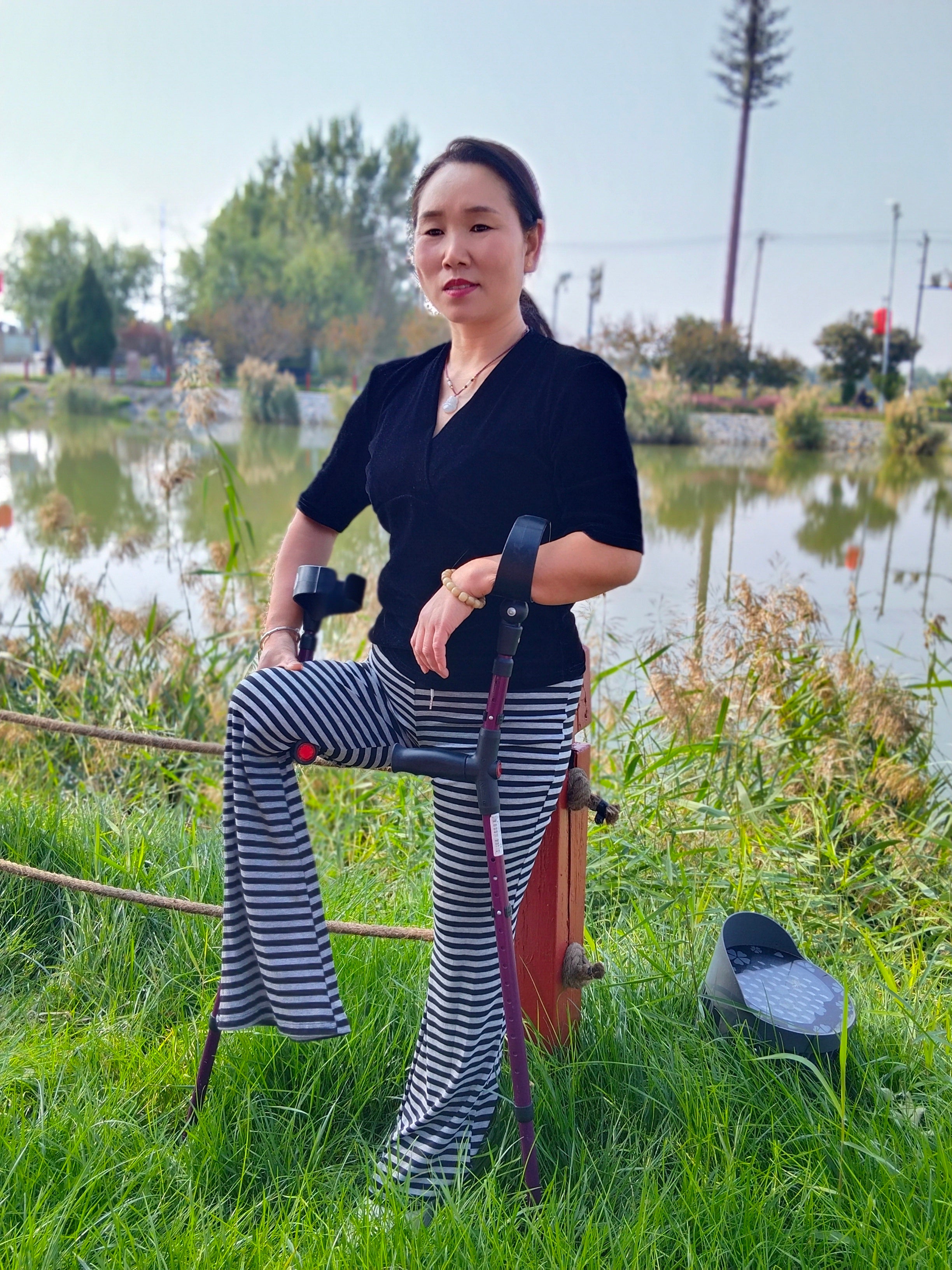 Gigi: Sak Amputee Girl - Using elbow crutches to go out for a walk in spring.