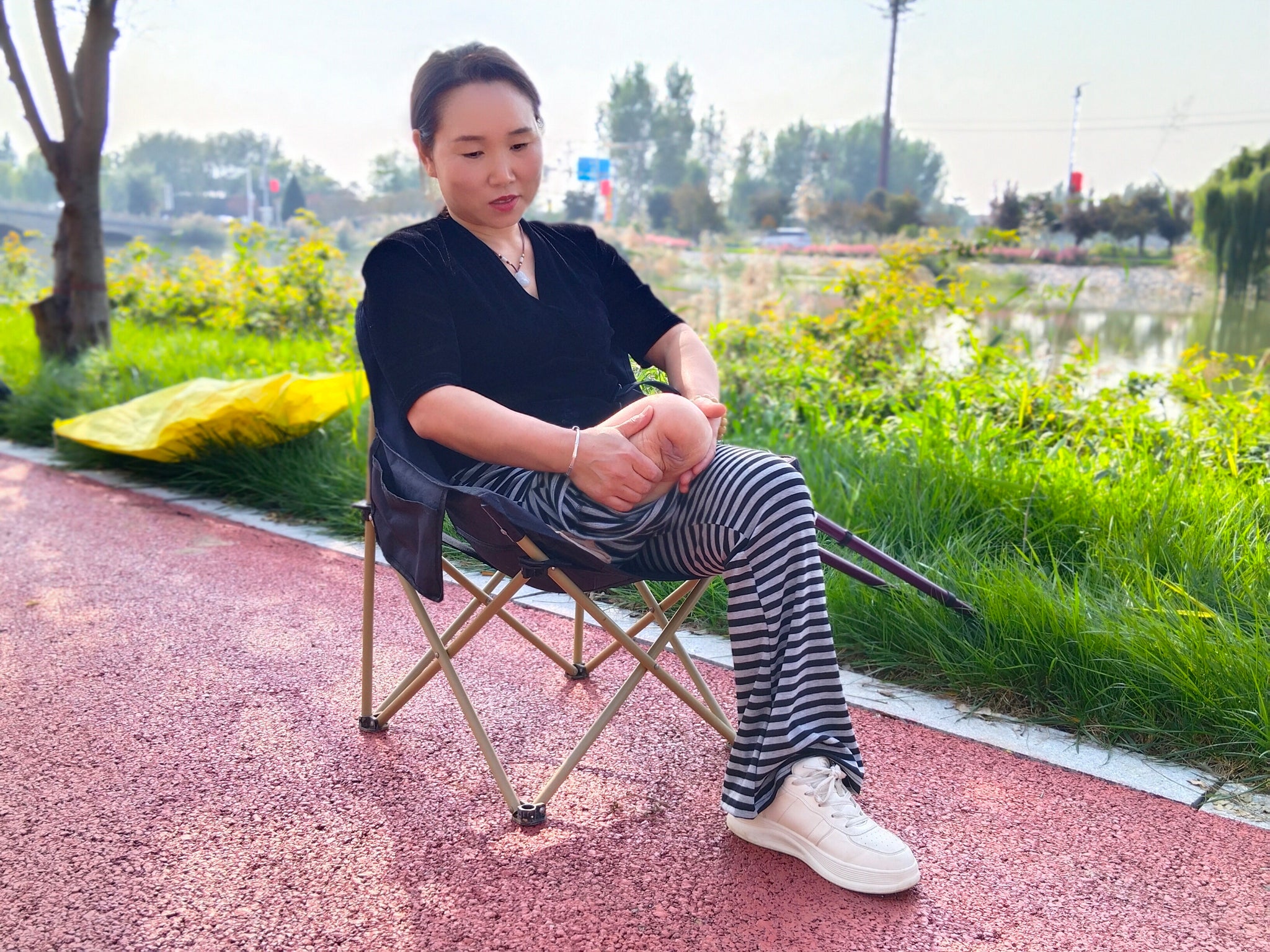 Gigi: Sak Amputee Girl - Using elbow crutches to go out for a walk in spring.