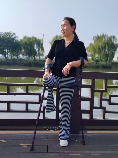 Gigi: Sak Amputee Girl - Using elbow crutches to go out for a walk in spring.