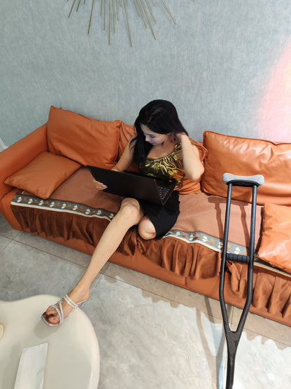 Rika Sak Amputee Girl: Gold strapless top with black mini skirt and stockings