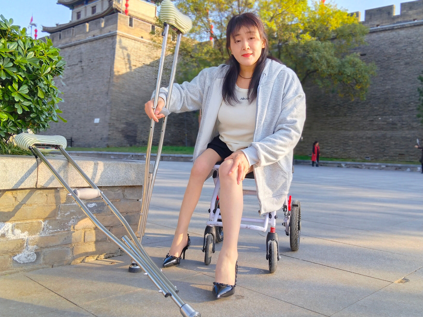 Rose, a girl with polio, climbed the stairs wearing high heels and using crutches.