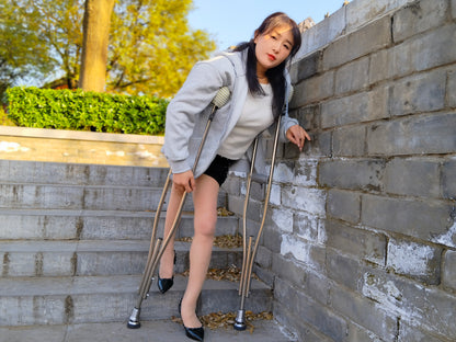 Rose, a girl with polio, climbed the stairs wearing high heels and using crutches.