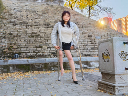 Rose, a girl with polio, climbed the stairs wearing high heels and using crutches.