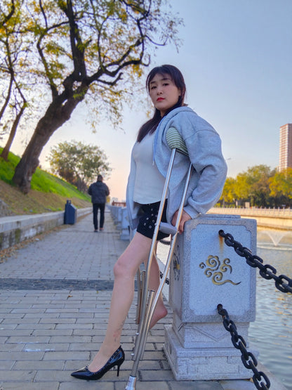 Rose, a girl with polio, climbed the stairs wearing high heels and using crutches.