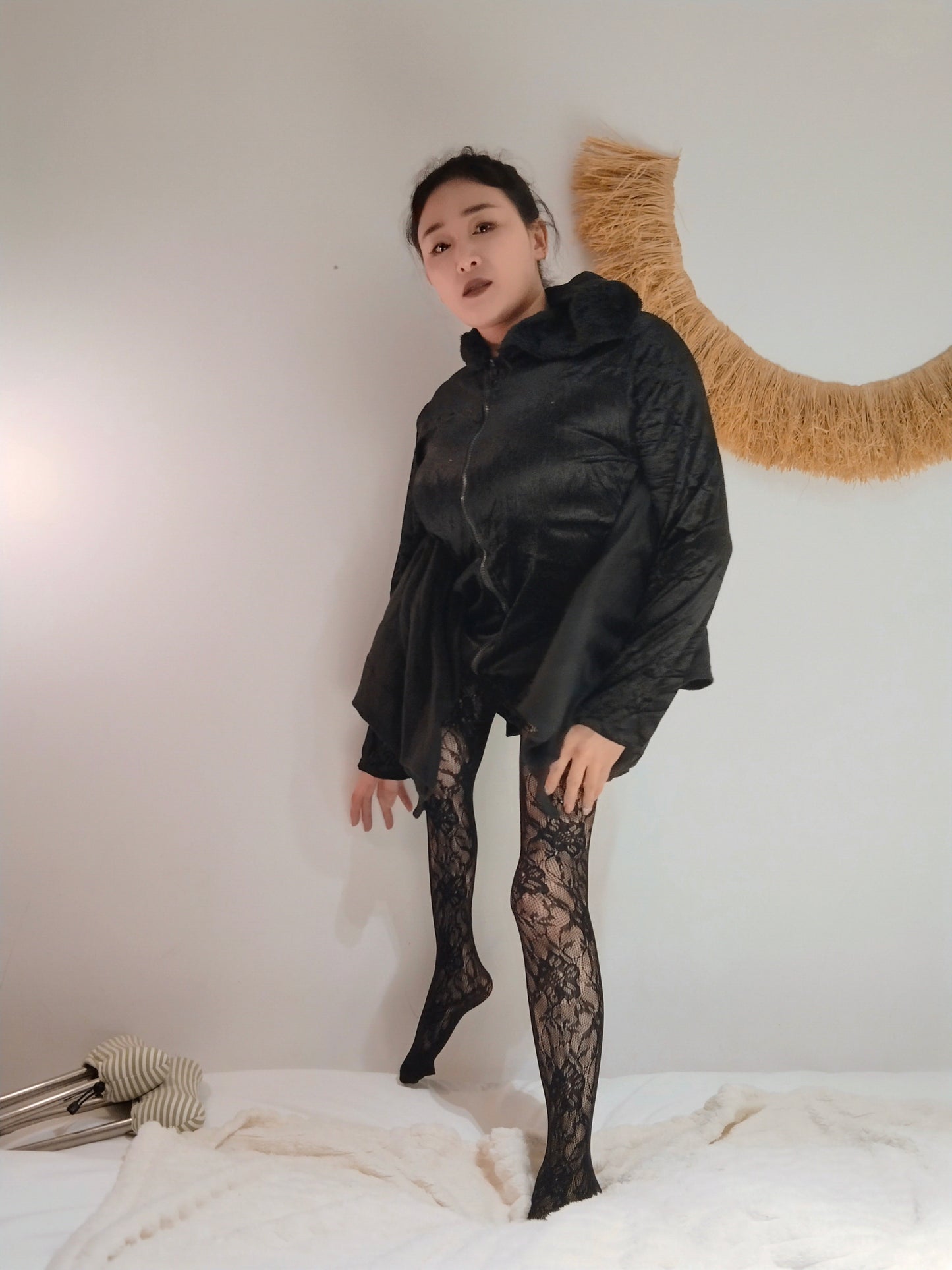 Rose The Polio Girl: A bold departure – black maxi dress， lace stockings,high heels.