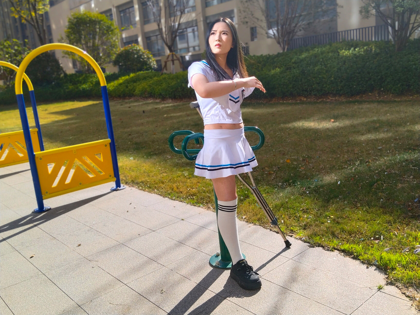 Beibei: OOE Amputee Girl, practicing walking with crutches while wearing a sailor uniform and a very short skirt.
