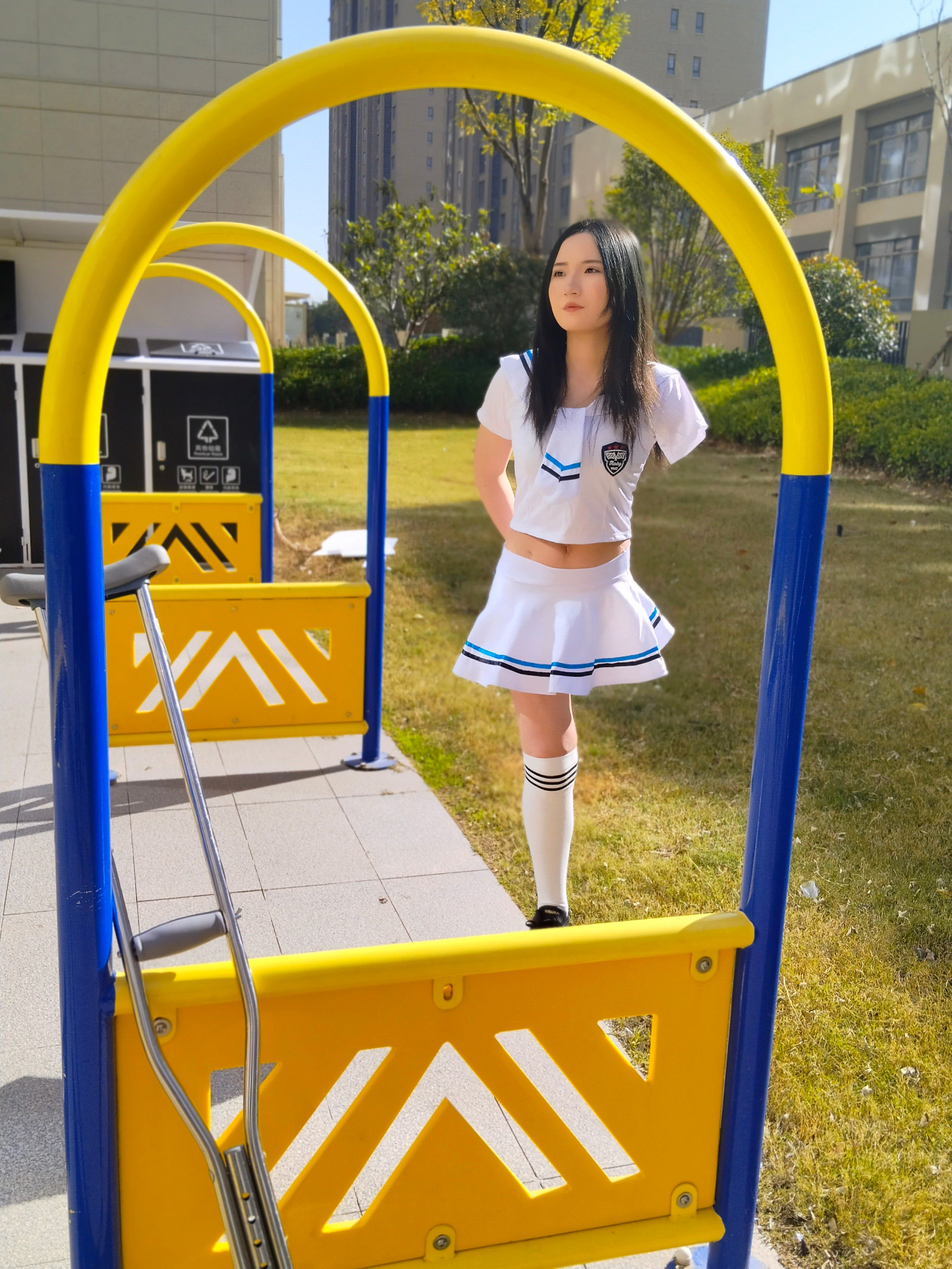 Beibei: OOE Amputee Girl, practicing walking with crutches while wearing a sailor uniform and a very short skirt.