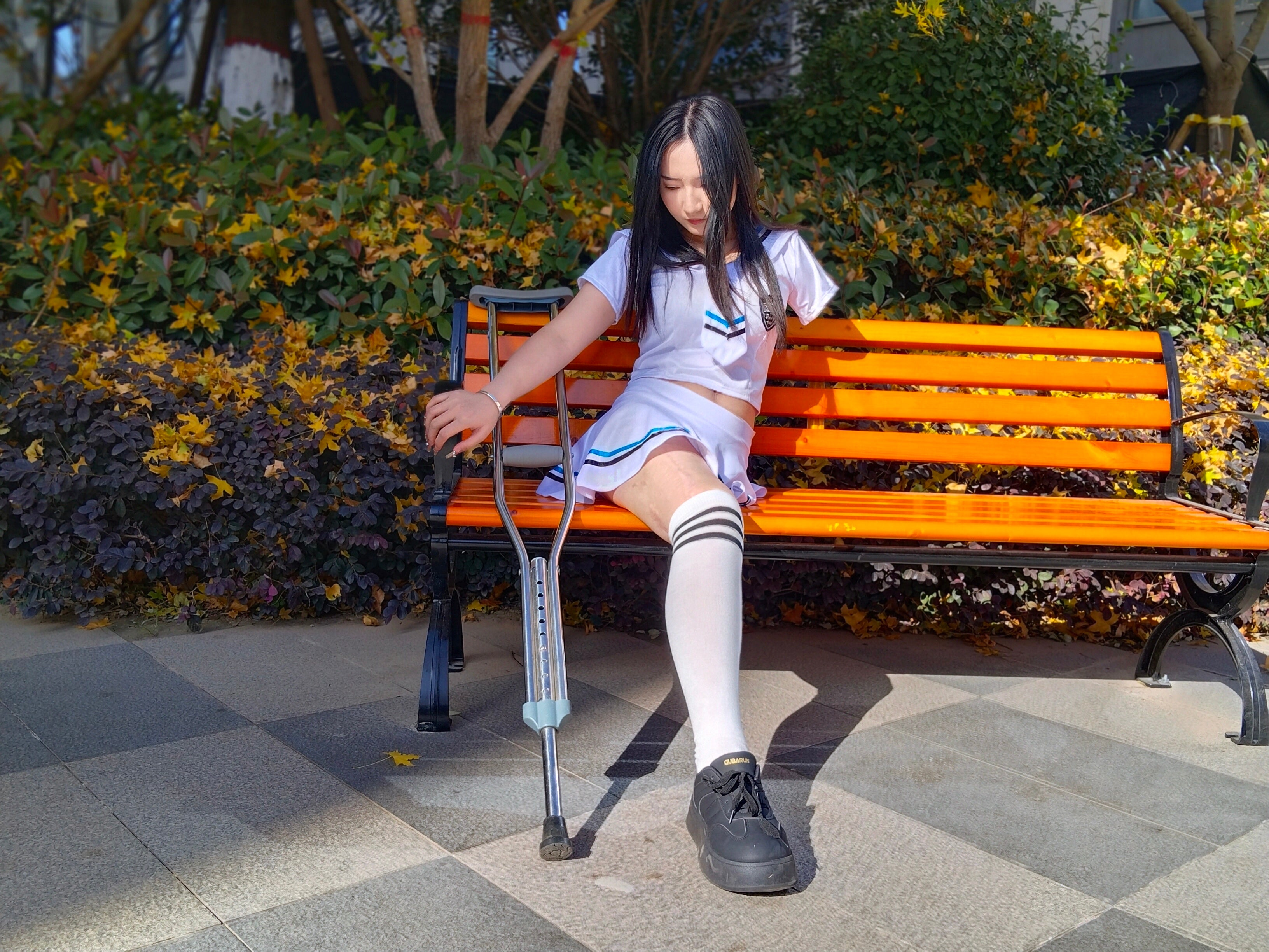 Beibei: OOE Amputee Girl, practicing walking with crutches while wearing a sailor uniform and a very short skirt.