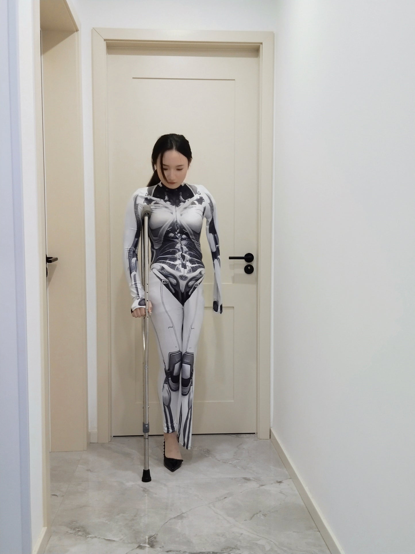 Beibei: OOE Amputee Girl cosplaying as a mechanical girl in an electric wheelchair.