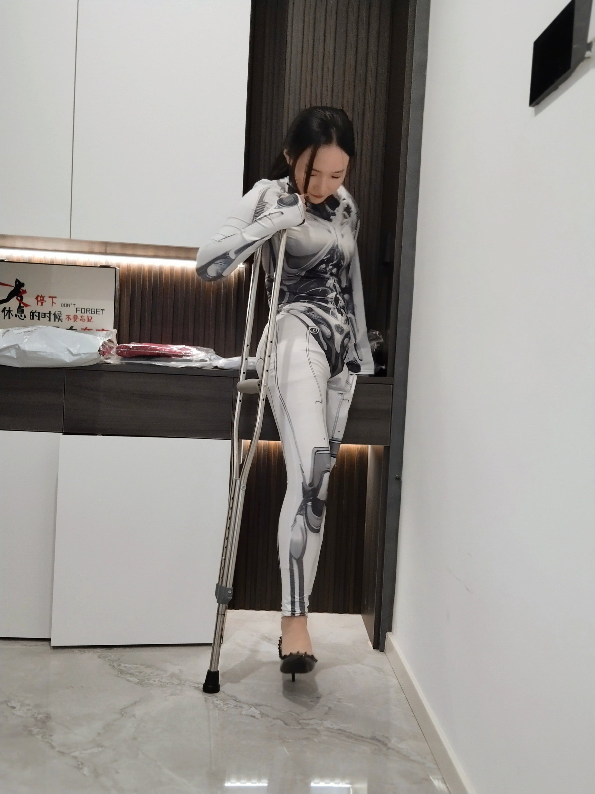 Beibei: OOE Amputee Girl cosplaying as a mechanical girl in an electric wheelchair.