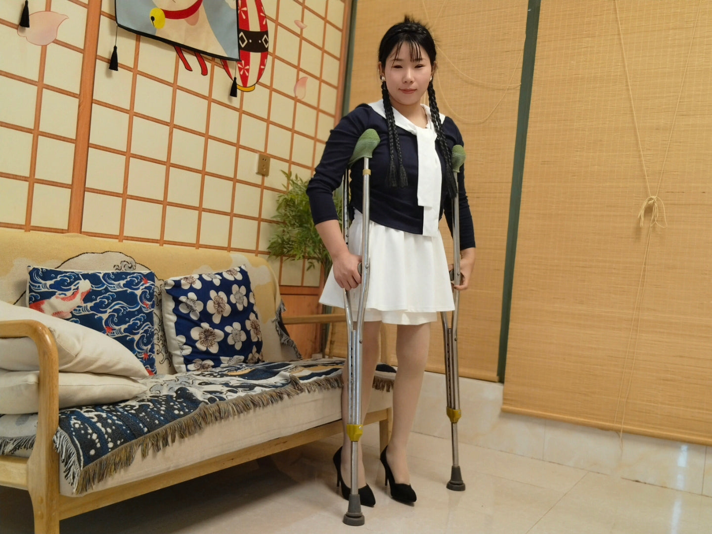 Twlia Polio girl's cane, flesh-colored stockings, and black high heels