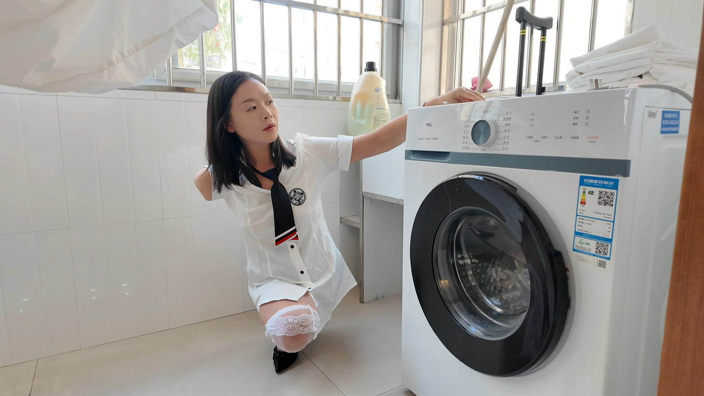 Mila: Ooe Amputee Girl - Walking indoors with crutches while wearing a white shirt and uniform.