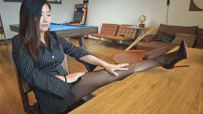 Emma: Shd Amputee Girl displays her beautiful legs in black stockings and her prosthetic limb on a billiard table.