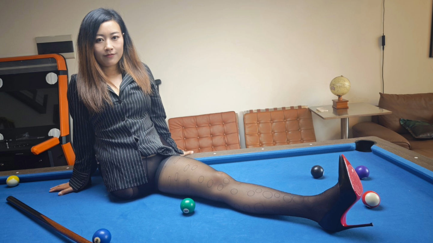 Emma: Shd Amputee Girl displays her beautiful legs in black stockings and her prosthetic limb on a billiard table.