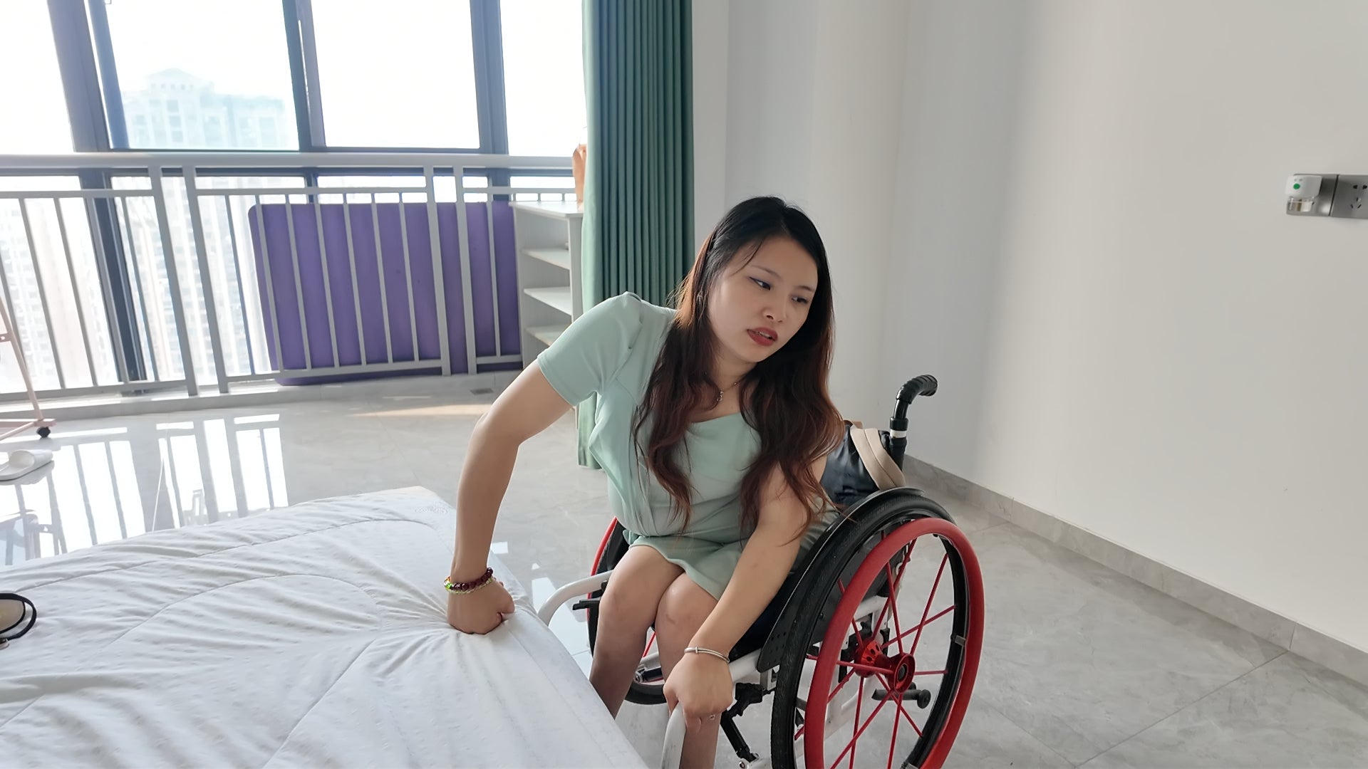Shera: Paraplegic Girl tries on black strappy high heels at home.