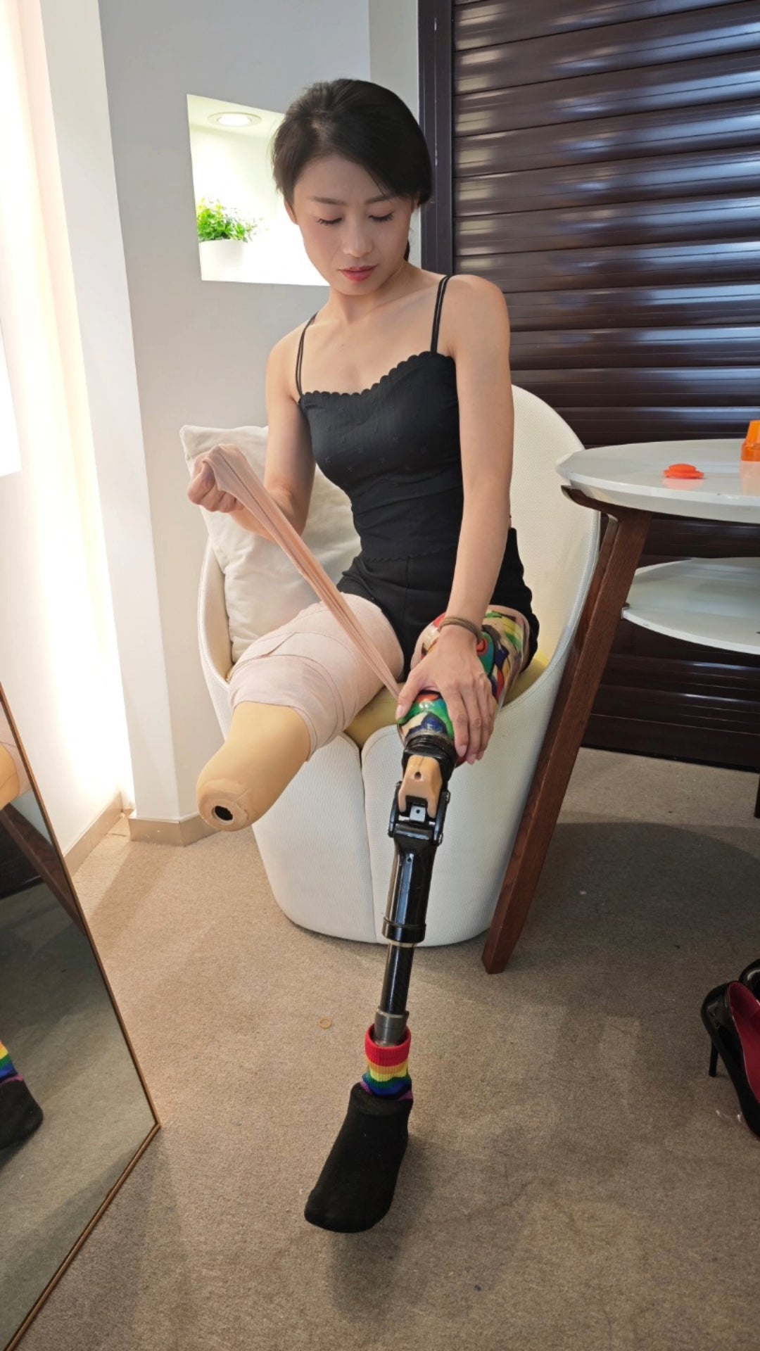 Ayla: Sak, the amputee girl, is wearing a black tank top and pretending to be Dak.