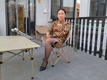 Gigi: Sak Amputee Girl, wearing leopard print stockings and using crutches