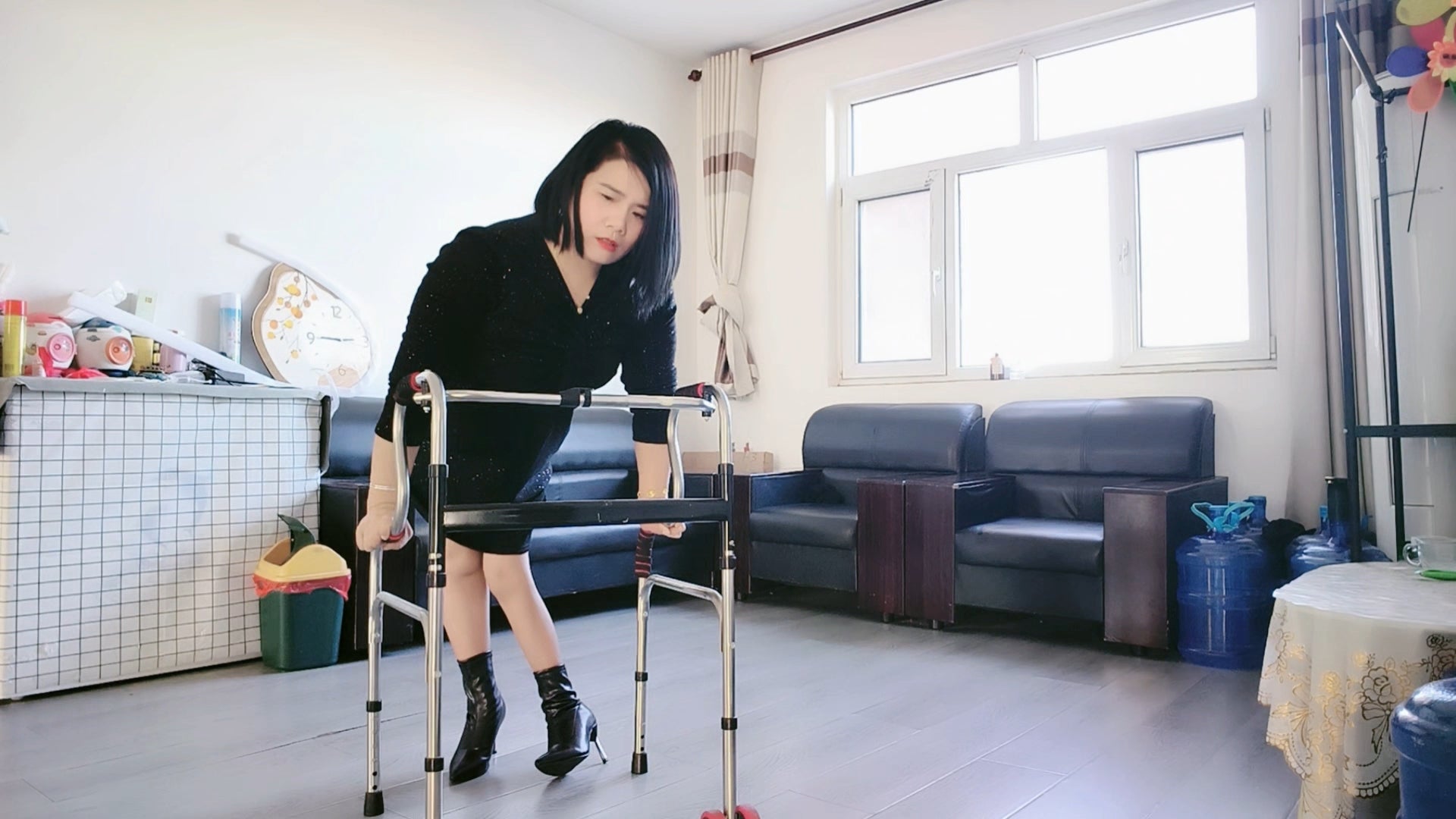 Carrie: The Polio Lady's ground-to-sofa transfer using assistive walking devices.